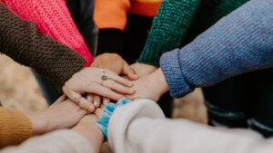 Ask for customer testimonials all hands in teamwork